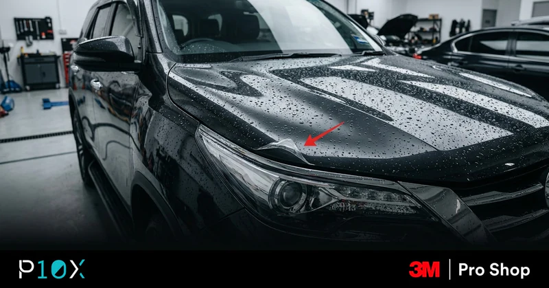 Peeling PPF replacement question shown by a lifted film edge on a silver car bonnet.