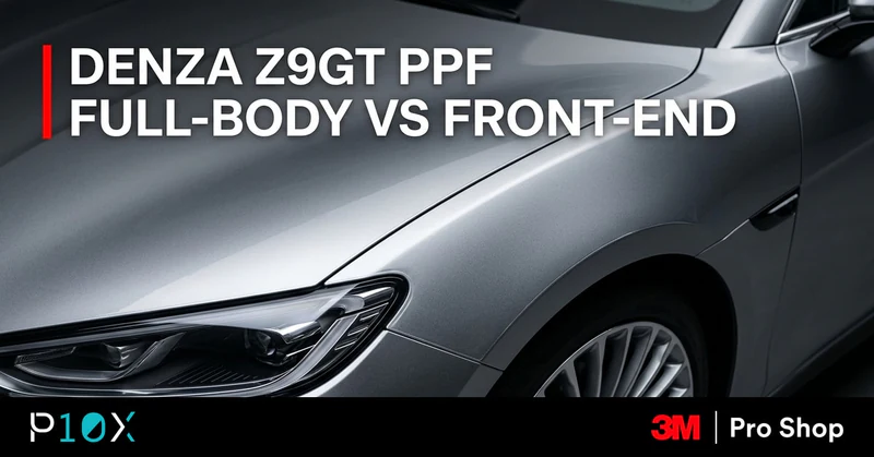 Silver Denza Z9GT grand tourer in a dark studio with clear 3M paint protection film on the front end.