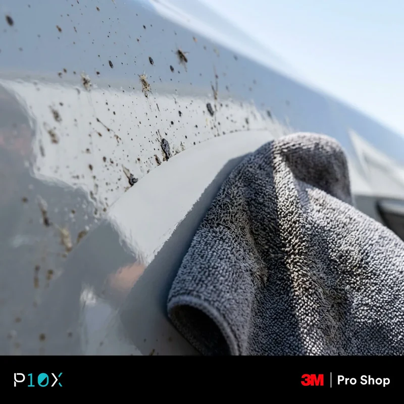 Lifting tar and bug splatter from PPF with a soaked microfiber and dwell time
